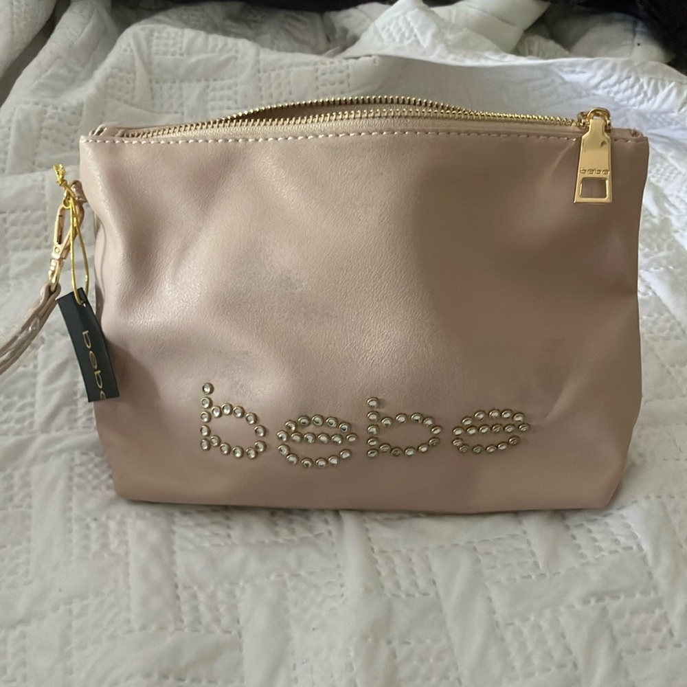 Bebe top zip wristlet blush color